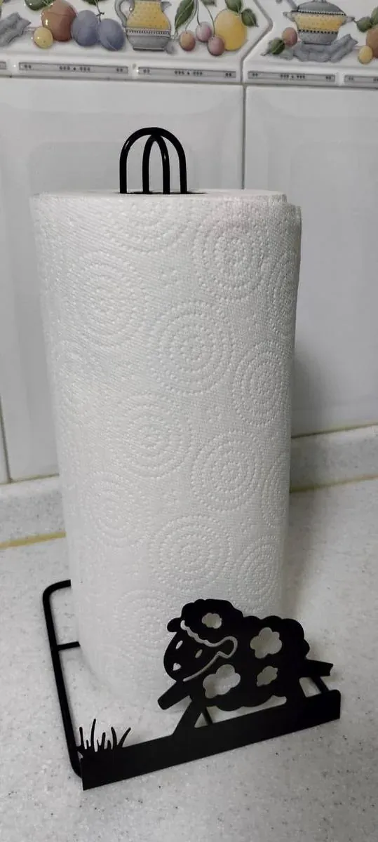 Portarrollos decorativo de acero fabricado por ARANSA — Base de lámina con figura cortada y acabado negro.