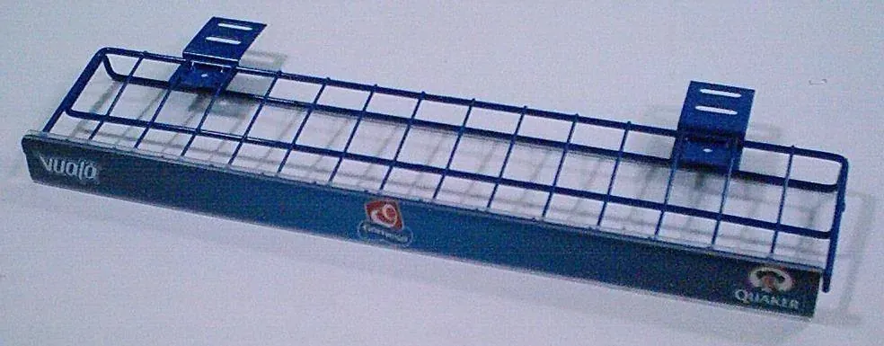 Canastilla con cabecera de acero fabricado por ARANSA — Canastilla a muro con frente gráfico.